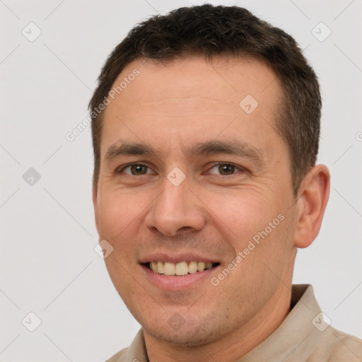 Joyful white adult male with short  brown hair and brown eyes