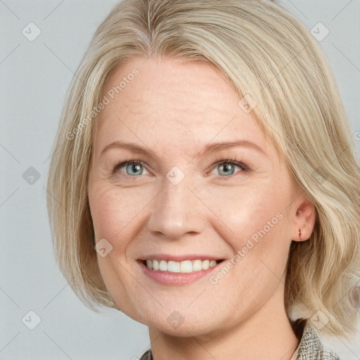 Joyful white young-adult female with medium  blond hair and blue eyes