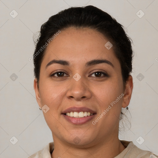 Joyful latino young-adult female with short  brown hair and brown eyes