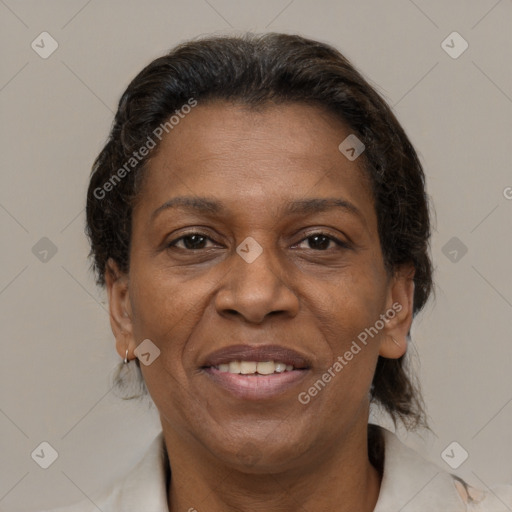 Joyful latino adult female with medium  brown hair and brown eyes
