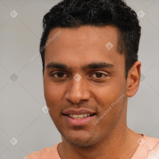 Joyful white young-adult male with short  black hair and brown eyes