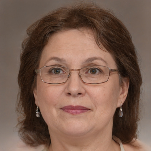 Joyful white middle-aged female with medium  brown hair and blue eyes