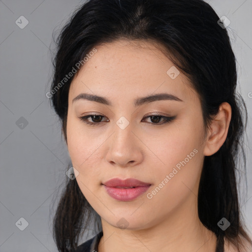 Joyful asian young-adult female with long  brown hair and brown eyes