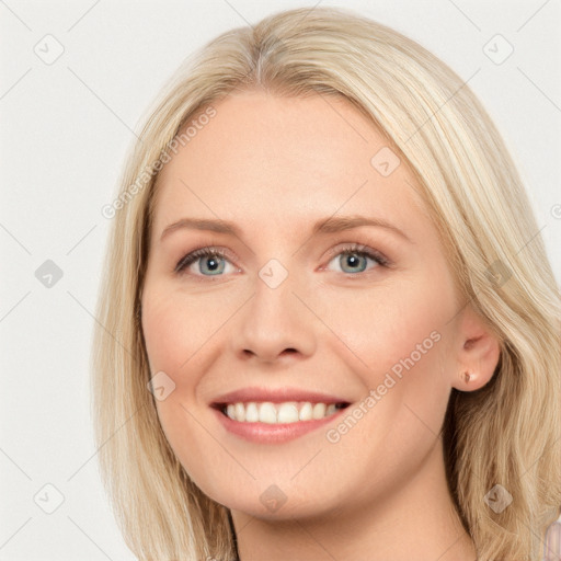 Joyful white young-adult female with long  brown hair and blue eyes