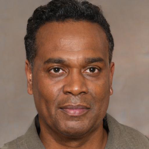 Neutral black adult male with short  black hair and brown eyes