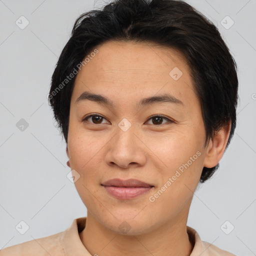 Joyful asian young-adult female with short  brown hair and brown eyes