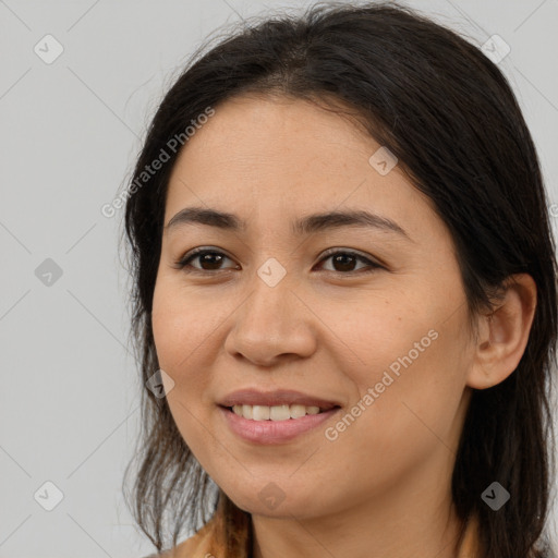 Joyful latino young-adult female with long  brown hair and brown eyes