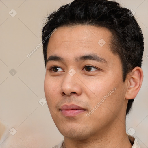 Neutral white young-adult male with short  black hair and brown eyes