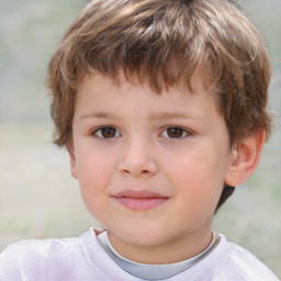 Joyful white child male with short  brown hair and brown eyes