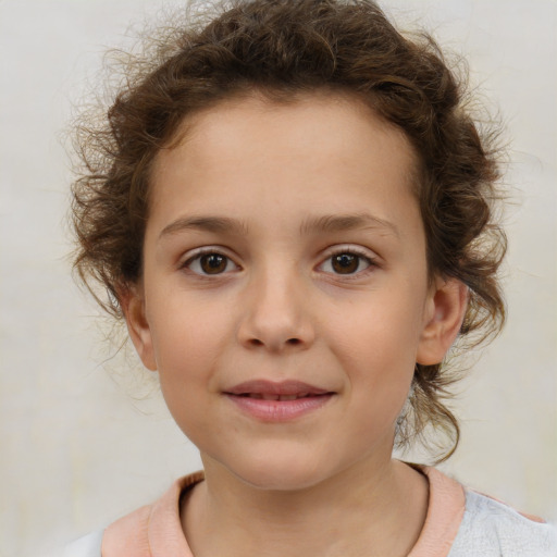 Joyful white child female with short  brown hair and brown eyes