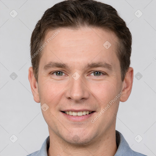 Joyful white adult male with short  brown hair and grey eyes