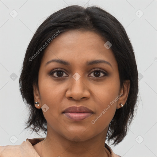 Joyful black young-adult female with medium  brown hair and brown eyes
