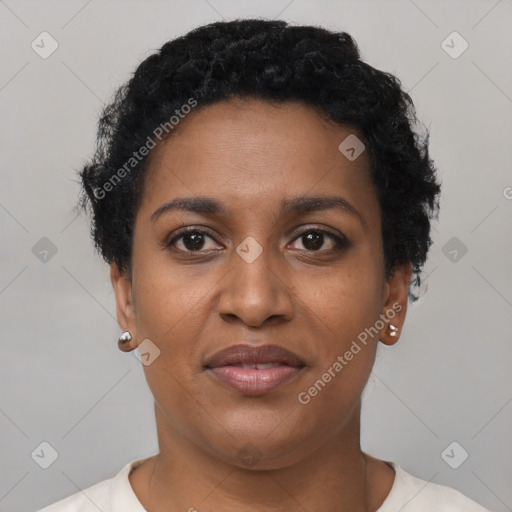 Joyful black young-adult female with short  black hair and brown eyes