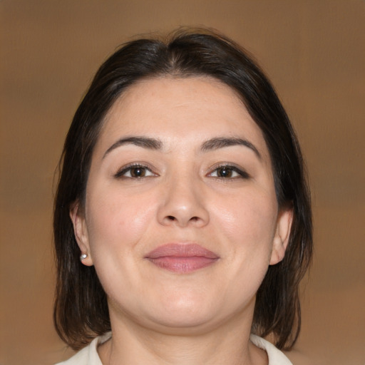 Joyful white young-adult female with medium  brown hair and brown eyes