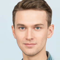 Joyful white young-adult male with short  brown hair and grey eyes