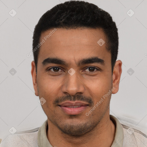 Joyful latino young-adult male with short  black hair and brown eyes
