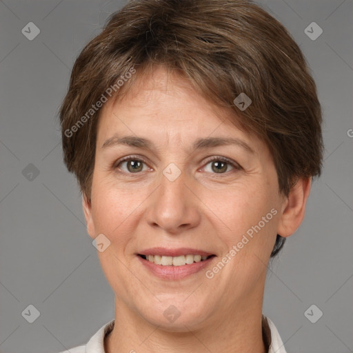 Joyful white adult female with short  brown hair and brown eyes