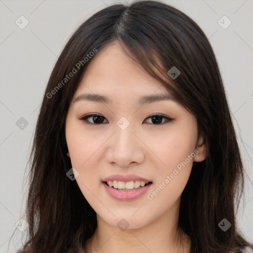 Joyful asian young-adult female with long  brown hair and brown eyes