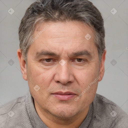 Joyful white middle-aged male with short  brown hair and brown eyes