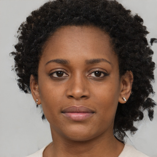 Neutral black young-adult female with short  brown hair and brown eyes