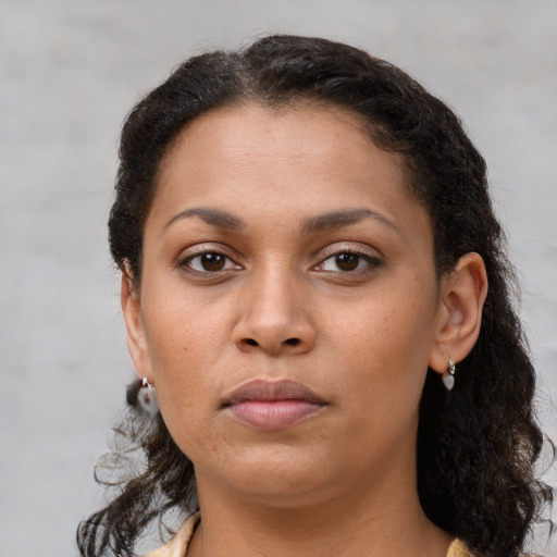 Neutral latino young-adult female with medium  brown hair and brown eyes