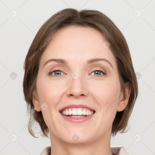 Joyful white adult female with medium  brown hair and grey eyes