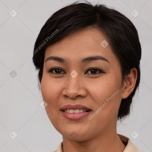 Joyful asian young-adult female with short  brown hair and brown eyes