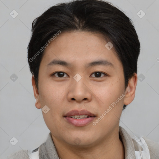 Joyful asian young-adult male with short  brown hair and brown eyes