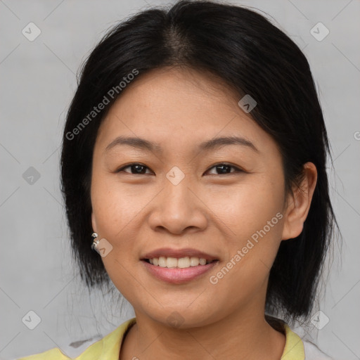 Joyful asian young-adult female with medium  brown hair and brown eyes