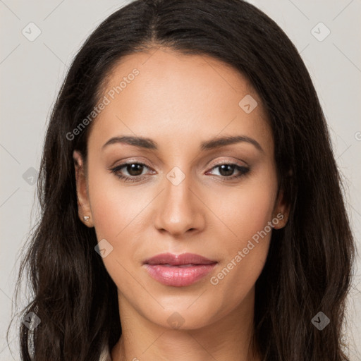 Joyful latino young-adult female with long  brown hair and brown eyes