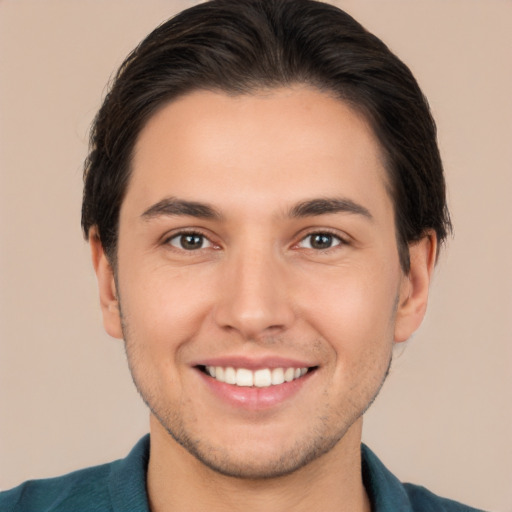 Joyful white young-adult male with short  brown hair and brown eyes