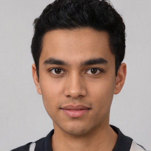 Neutral latino young-adult male with short  black hair and brown eyes