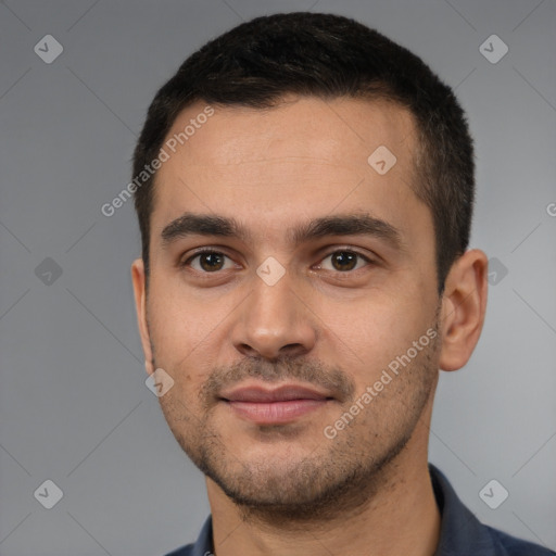 Joyful white young-adult male with short  brown hair and brown eyes