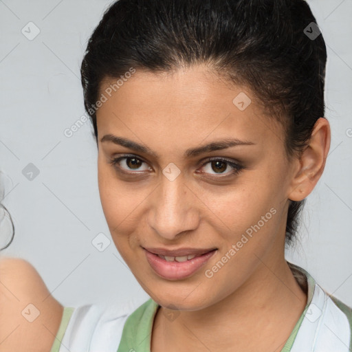 Joyful white young-adult female with short  brown hair and brown eyes