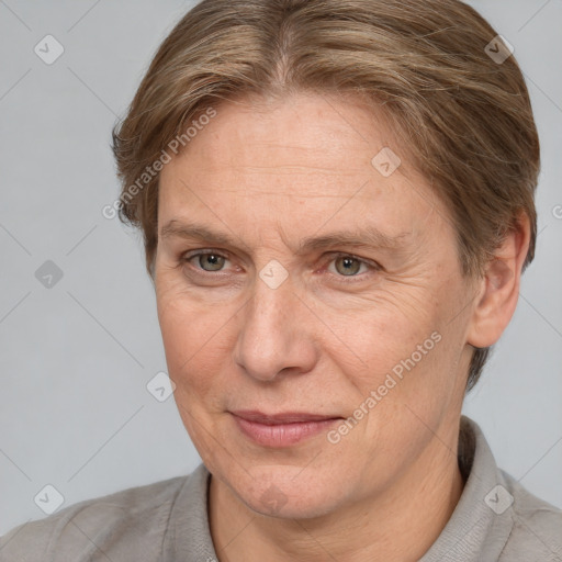 Joyful white adult female with short  brown hair and brown eyes