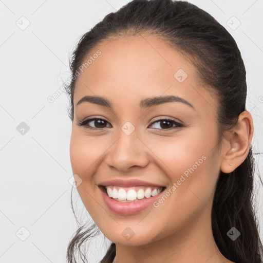 Joyful white young-adult female with long  brown hair and brown eyes