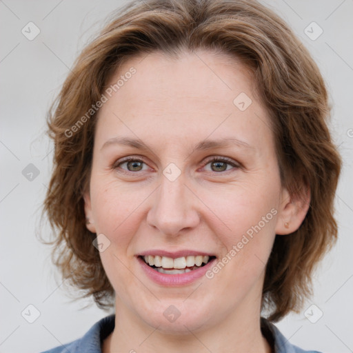 Joyful white young-adult female with medium  brown hair and blue eyes