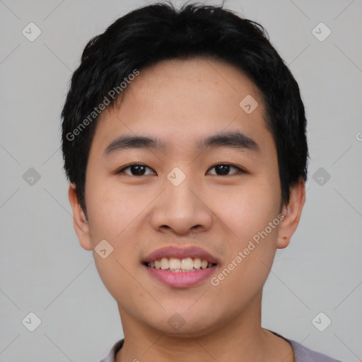 Joyful asian young-adult male with short  black hair and brown eyes