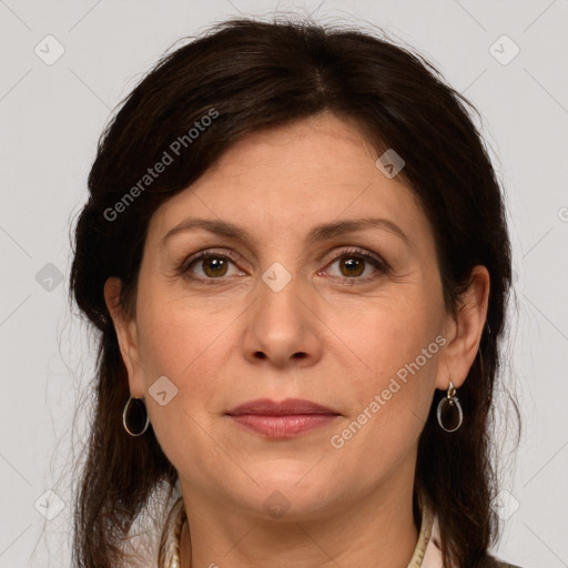 Joyful white adult female with medium  brown hair and grey eyes