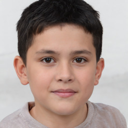 Joyful white child male with short  brown hair and brown eyes