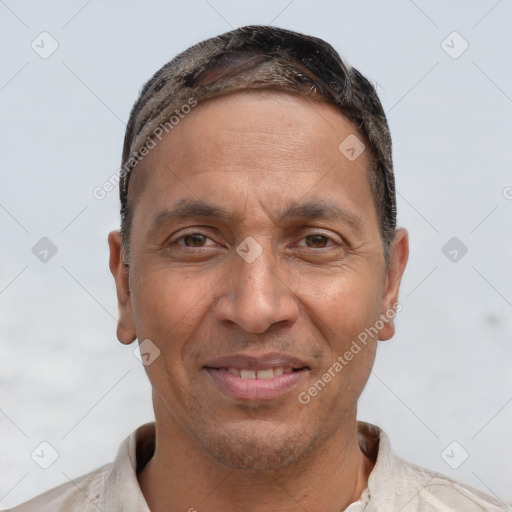 Joyful white adult male with short  brown hair and brown eyes