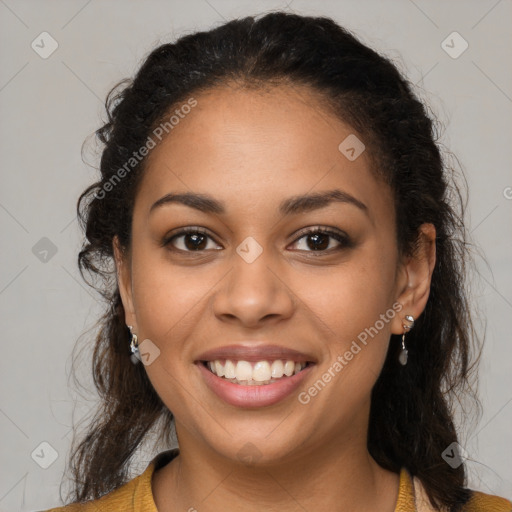 Joyful latino young-adult female with long  brown hair and brown eyes