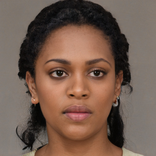 Neutral black young-adult female with medium  black hair and brown eyes