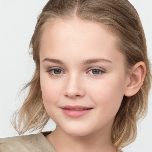 Joyful white child female with medium  brown hair and grey eyes