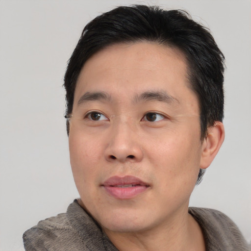 Neutral asian young-adult male with short  black hair and brown eyes