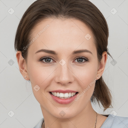 Joyful white young-adult female with medium  brown hair and grey eyes