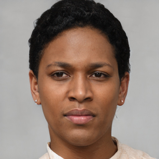 Joyful latino young-adult female with short  black hair and brown eyes