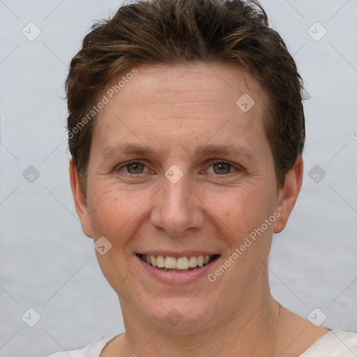 Joyful white adult female with short  brown hair and brown eyes