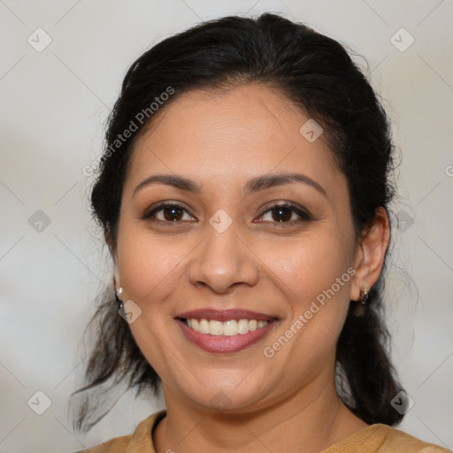 Joyful latino young-adult female with medium  brown hair and brown eyes