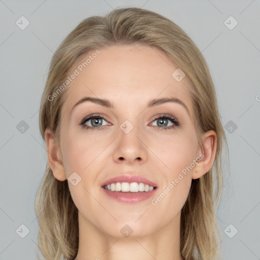 Joyful white young-adult female with long  brown hair and blue eyes